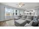 Bright living room with a large sectional sofa, access to an outdoor patio, and views of the backyard at 204 Honey Horn Dr, Summerville, SC 29486
