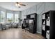 Bright office space with modern geometric wall design, desk with monitors, comfortable seating, and ample storage at 204 Honey Horn Dr, Summerville, SC 29486