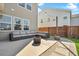 Cozy outdoor patio featuring a comfortable seating arrangement and a modern fire pit, creating an inviting space at 204 Honey Horn Dr, Summerville, SC 29486