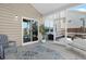 Covered patio with screened in porch featuring a plush couch and sliding doors to seamlessly integrate indoor and outdoor spaces at 204 Honey Horn Dr, Summerville, SC 29486