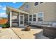 Beautiful patio with a cozy outdoor seating arrangement and a screened-in porch for relaxed outdoor living and entertaining at 204 Honey Horn Dr, Summerville, SC 29486