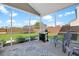 Enclosed back porch with a grill overlooking the spacious backyard, perfect for outdoor entertaining and relaxation at 204 Honey Horn Dr, Summerville, SC 29486