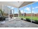 Screened-in patio with seamless transition to the backyard featuring a playset and a bench, perfect for outdoor enjoyment at 204 Honey Horn Dr, Summerville, SC 29486