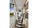 Front porch with rocking chairs and hanging flower baskets at 204 Honey Horn Dr, Summerville, SC 29486