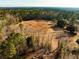 Aerial view of the expansive acreage, perfect for farming, recreation, or development at 2042 Highway 402, Moncks Corner, SC 29461