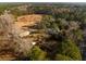 Expansive land with a home, outbuilding, and picturesque pond at 2042 Highway 402, Moncks Corner, SC 29461