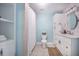 Updated bathroom with modern sink, white cabinetry, shower with curtain, and a woven rug at 2042 Highway 402, Moncks Corner, SC 29461