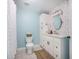 Bathroom featuring modern tiling, white cabinets, and updated fixtures, offering a fresh space at 2042 Highway 402, Moncks Corner, SC 29461