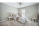 Cozy bedroom featuring a single bed, soft pink accents, and a vintage bedside table with lamp at 2042 Highway 402, Moncks Corner, SC 29461