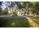 Long driveway leading to the house with beautiful mature trees lining the drive at 2042 Highway 402, Moncks Corner, SC 29461