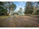 A lovely home featuring mature trees on a large lot with lush, green landscaping at 2042 Highway 402, Moncks Corner, SC 29461
