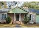 A charming home with classic design, brick accents, and a cozy front porch at 2042 Highway 402, Moncks Corner, SC 29461