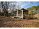Screened gazebo overlooks the pond and yard, near the other building on the property at 2042 Highway 402, Moncks Corner, SC 29461