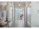 Hallway with hardwood floors, neutral wall paint, and views into adjacent rooms at 2042 Highway 402, Moncks Corner, SC 29461