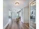 Hallway with hardwood floors that seamlessly connects the kitchen, living area and the rest of the house at 2042 Highway 402, Moncks Corner, SC 29461
