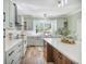 Bright kitchen with stainless steel appliances, white countertops, and light green cabinetry at 2042 Highway 402, Moncks Corner, SC 29461