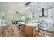Open concept kitchen with island seating and stainless appliances at 2042 Highway 402, Moncks Corner, SC 29461
