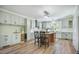Modern kitchen featuring light green cabinetry, stainless appliances and a central island at 2042 Highway 402, Moncks Corner, SC 29461