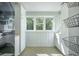 Bright laundry room with white cabinets, natural light, and modern appliances at 2042 Highway 402, Moncks Corner, SC 29461