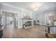 Spacious living room with natural light, stylish furnishings, and an inviting fireplace as focal point at 2042 Highway 402, Moncks Corner, SC 29461