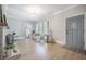 Open living area with hardwood floors, fireplace, natural light, and stylish, neutral decor at 2042 Highway 402, Moncks Corner, SC 29461