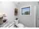 Bright bathroom features a granite countertop, toilet, and a large window at 208 Langham Ct, Moncks Corner, SC 29461