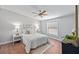 Cozy bedroom features hardwood floors, ceiling fan, and plenty of natural light from the window at 208 Langham Ct, Moncks Corner, SC 29461