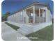Charming one-story home boasts a covered porch and freshly cut lawn at 208 Langham Ct, Moncks Corner, SC 29461