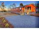 Attractive exterior of this one-story home boasts fresh paint and a gravel driveway at 208 Langham Ct, Moncks Corner, SC 29461