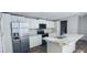 Kitchen boasts stainless steel appliances, white cabinets, and marble countertops, island sink included at 208 Langham Ct, Moncks Corner, SC 29461