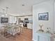 Modern kitchen features white cabinets, stainless steel appliances, a center island with bar stool seating and stylish decorations at 208 Langham Ct, Moncks Corner, SC 29461