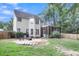 Expansive backyard featuring a patio area with seating, a lush lawn, and mature trees that create a private setting at 2136 Baldwin Park Dr, Mount Pleasant, SC 29466