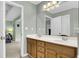 Bathroom featuring double sink vanity with wood cabinets and a large mirror at 2136 Baldwin Park Dr, Mount Pleasant, SC 29466