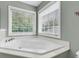 Soaking tub in modern bathroom with light paint at 2136 Baldwin Park Dr, Mount Pleasant, SC 29466