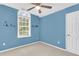 Vibrant blue bedroom with themed decor and a sunny window at 2136 Baldwin Park Dr, Mount Pleasant, SC 29466