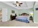 Bedroom featuring a ceiling fan, carpet, and a large window allowing ample natural light at 2136 Baldwin Park Dr, Mount Pleasant, SC 29466