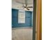 Blue bedroom with a ceiling fan, window and neutral carpeting at 2136 Baldwin Park Dr, Mount Pleasant, SC 29466