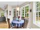 Charming breakfast nook with large windows, wood floors, and a stylish pendant light fixture at 2136 Baldwin Park Dr, Mount Pleasant, SC 29466