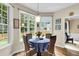 Cozy breakfast nook featuring a round table, wicker chairs, and large windows overlooking the yard at 2136 Baldwin Park Dr, Mount Pleasant, SC 29466
