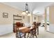 Traditional dining room with wood table set and an antique hutch under a decorative pendant lamp at 2136 Baldwin Park Dr, Mount Pleasant, SC 29466