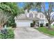 Charming two-story home with a well-maintained lawn, a two car garage, and lush landscaping in a quiet neighborhood at 2136 Baldwin Park Dr, Mount Pleasant, SC 29466