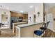 Well-lit kitchen with a breakfast bar, stainless steel appliances, and ample cabinet space at 2136 Baldwin Park Dr, Mount Pleasant, SC 29466
