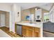 Open-concept kitchen featuring light countertops, stainless steel dishwasher, and seamless access to the living area at 2136 Baldwin Park Dr, Mount Pleasant, SC 29466