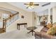 Bright and spacious living room with staircase, decorative columns, and seamless flow into the dining area at 2136 Baldwin Park Dr, Mount Pleasant, SC 29466