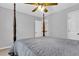 Well-lit bedroom featuring a four-poster bed and an ensuite doorway at 2136 Baldwin Park Dr, Mount Pleasant, SC 29466