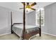 Elegant bedroom featuring a four poster bed, ceiling fan and window at 2136 Baldwin Park Dr, Mount Pleasant, SC 29466