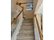 Carpeted staircase with white banister and wood handrail leads to the upper level at 2136 Baldwin Park Dr, Mount Pleasant, SC 29466