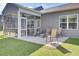 Back porch and patio featuring comfortable seating and a screened-in area, perfect for relaxation at 222 Hayworth Rd, Summerville, SC 29486