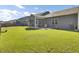 Spacious backyard with lush green grass, patio, and screened porch for outdoor enjoyment at 222 Hayworth Rd, Summerville, SC 29486