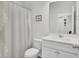 Clean and bright bathroom with a white vanity, neutral walls, and a shower with a striped curtain at 222 Hayworth Rd, Summerville, SC 29486